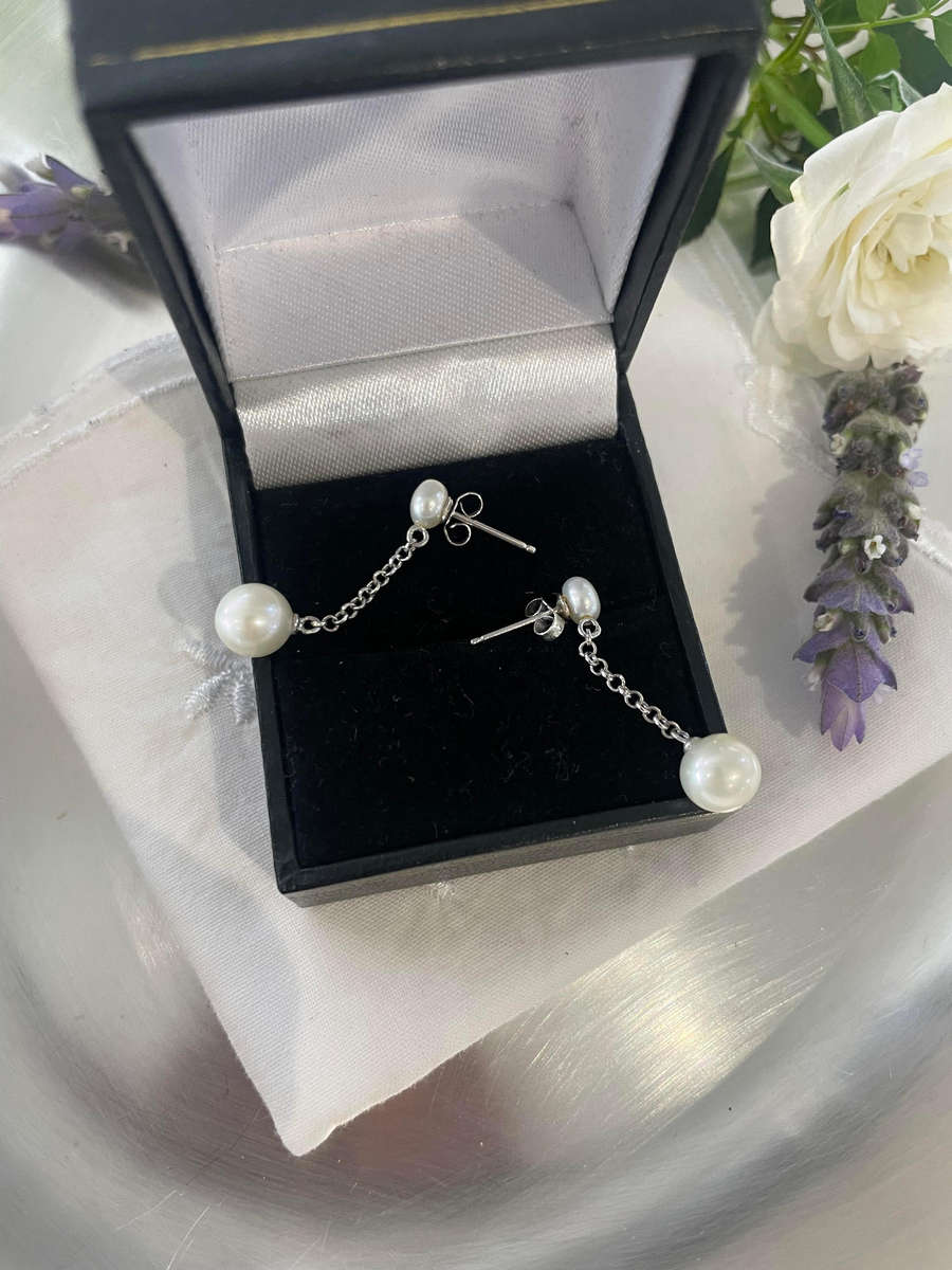 Delicate freshwater pearl double drop stud earrings 925 sterling silver setting and studs.