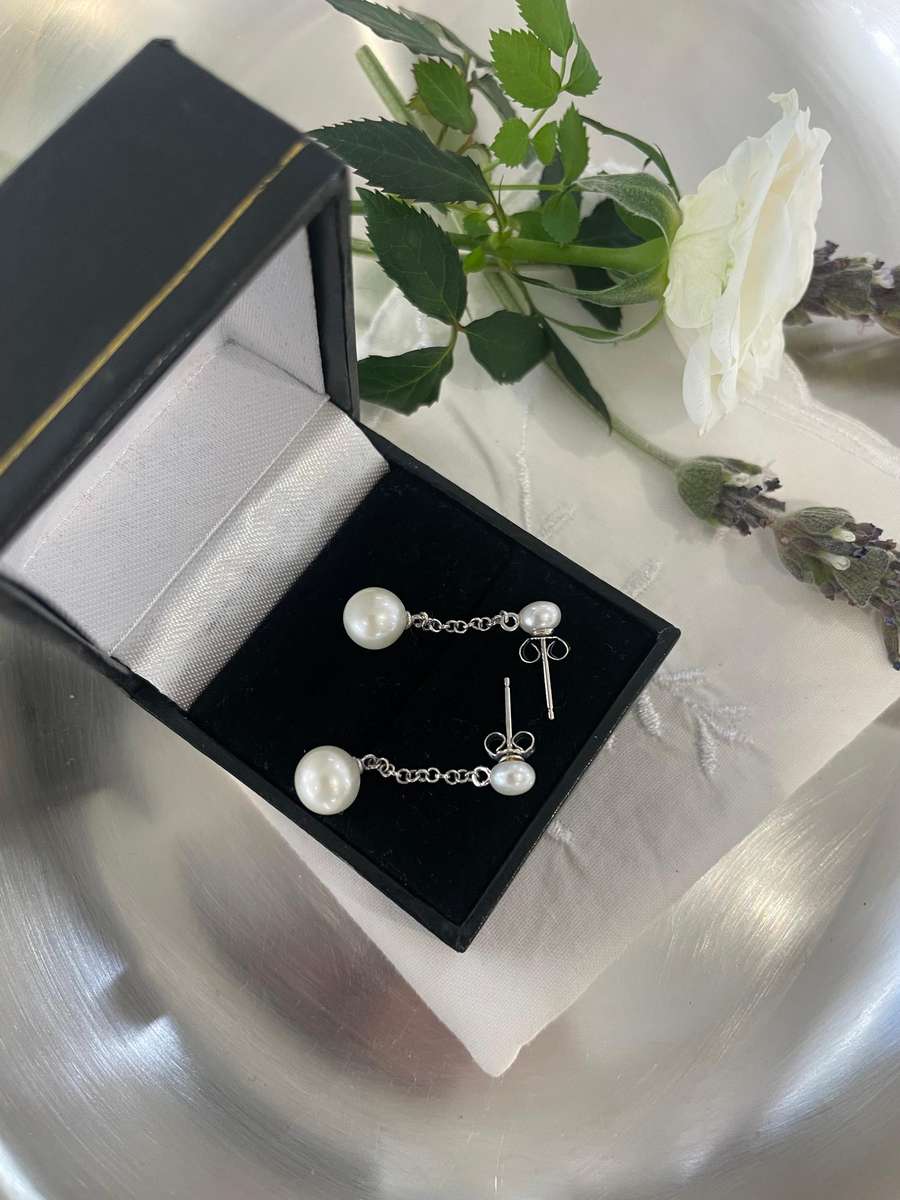 Delicate freshwater pearl double drop stud earrings 925 sterling silver setting and studs.