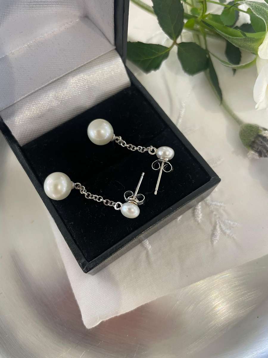 Delicate freshwater pearl double drop stud earrings 925 sterling silver setting and studs.