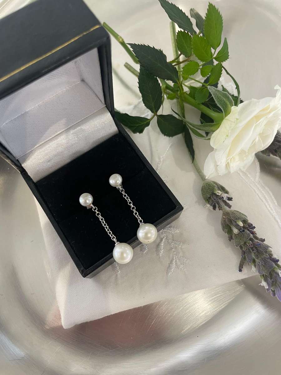 Delicate freshwater pearl double drop stud earrings 925 sterling silver setting and studs.