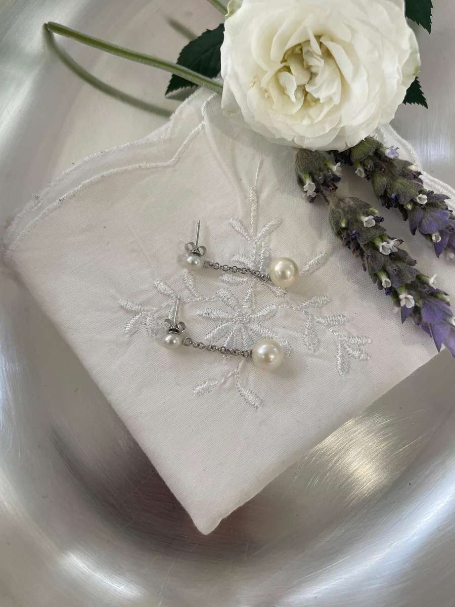 Delicate freshwater pearl double drop stud earrings 925 sterling silver setting and studs.