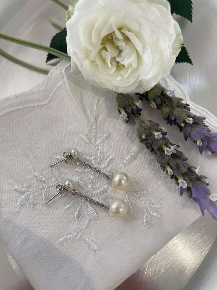 Delicate freshwater pearl double drop stud earrings 925 sterling silver setting and studs.