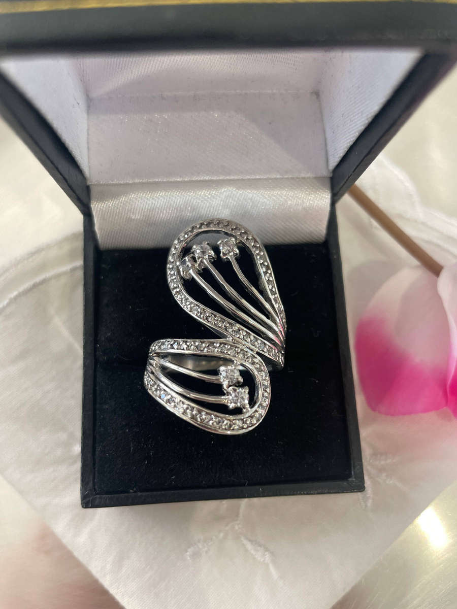 Unique Design 925 Sterling Silver "Stars Bypass" cocktail ring. Adorn with small clear stones!