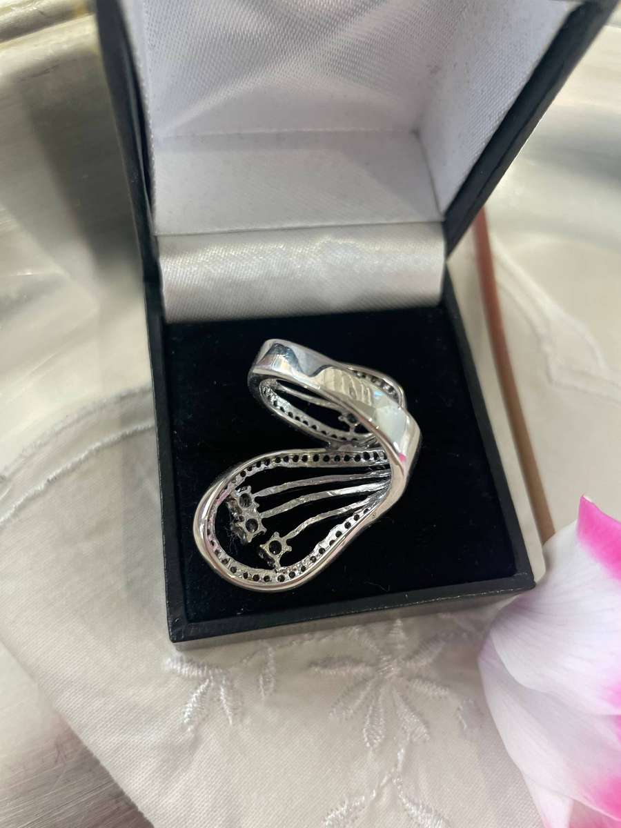 Unique Design 925 Sterling Silver "Stars Bypass" cocktail ring. Adorn with small clear stones!