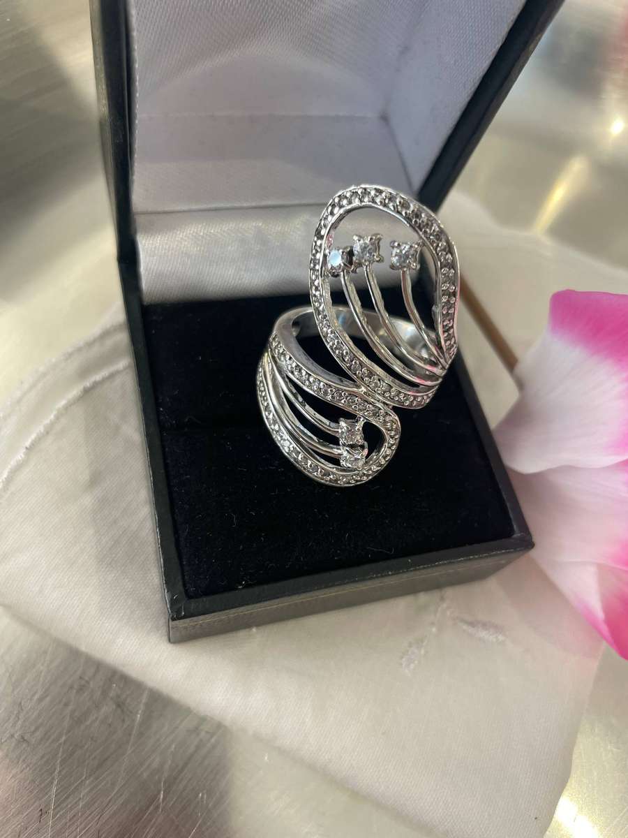 Unique Design 925 Sterling Silver "Stars Bypass" cocktail ring. Adorn with small clear stones!