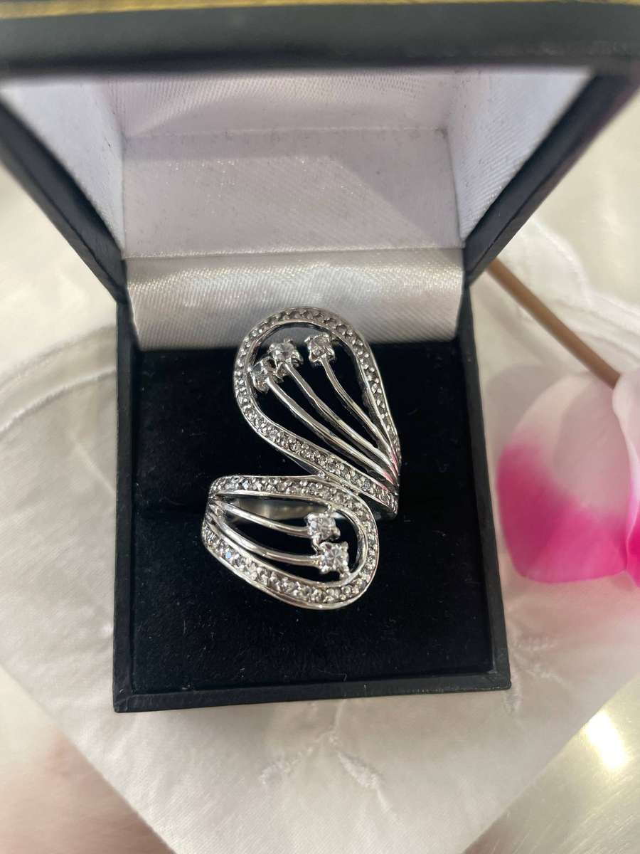 Unique Design 925 Sterling Silver "Stars Bypass" cocktail ring. Adorn with small clear stones!