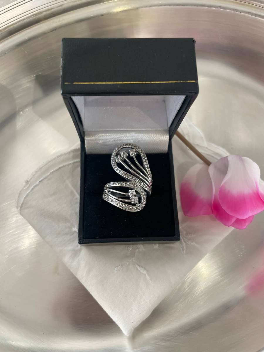 Unique Design 925 Sterling Silver "Stars Bypass" cocktail ring. Adorn with small clear stones!