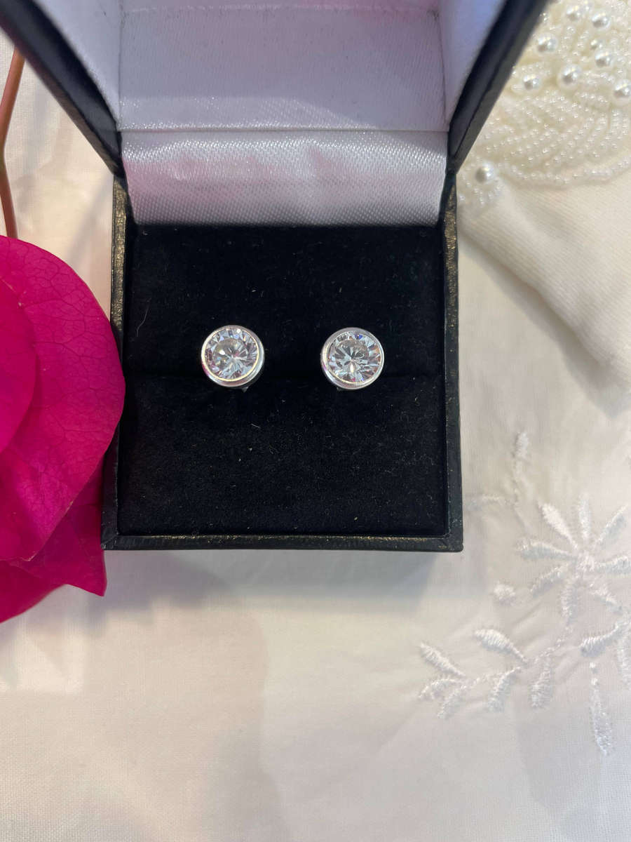 Sterling Silver .925 7mm Post Stud Cubic Zirconia Earrings/ Butterfly also .925 Sterling Silver.