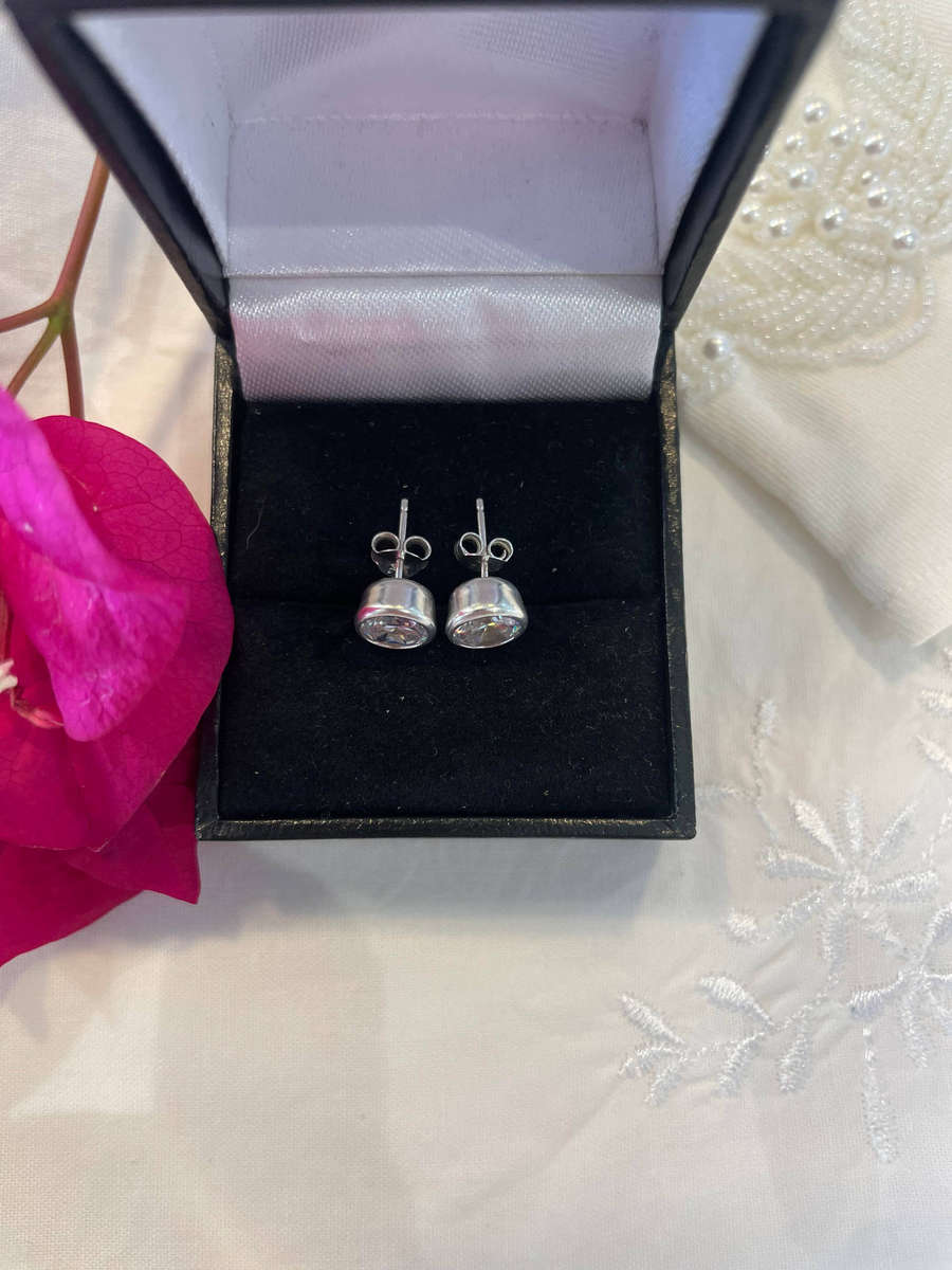 Sterling Silver .925 7mm Post Stud Cubic Zirconia Earrings/ Butterfly also .925 Sterling Silver.