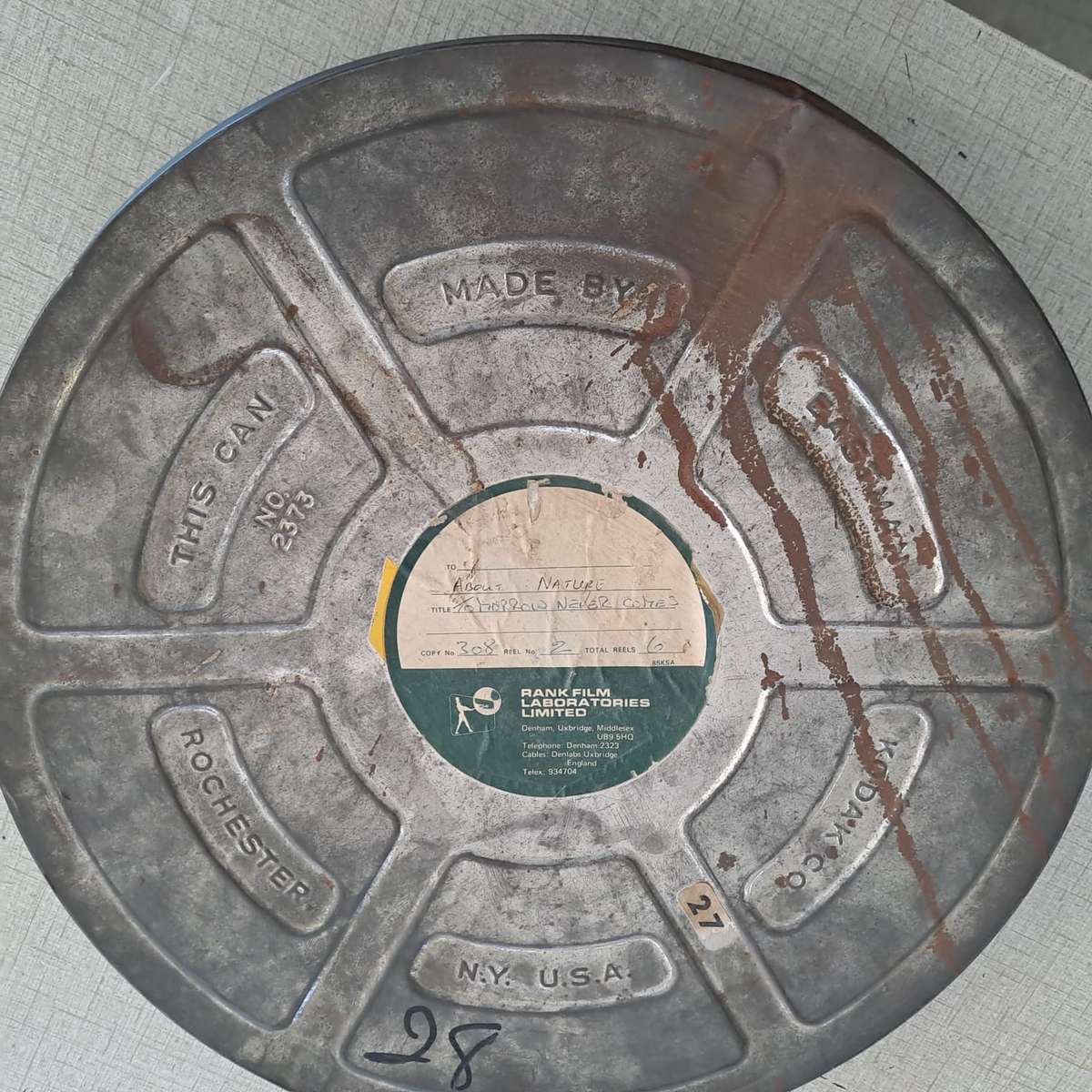 Vintage film canister with film - 38cm diameter. See description.