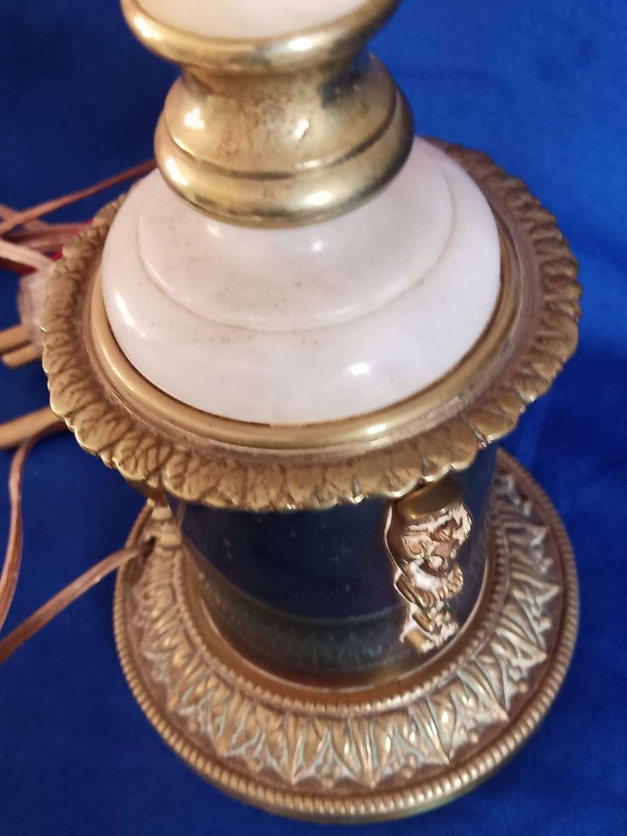 This is a vintage white marble and brass table lamp with ornate, possibly Empire-style