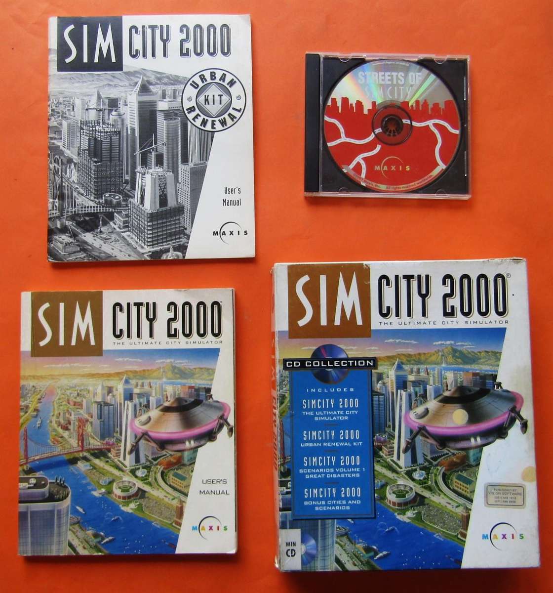 Box and Manuals for a Sim City 2000 PC Game