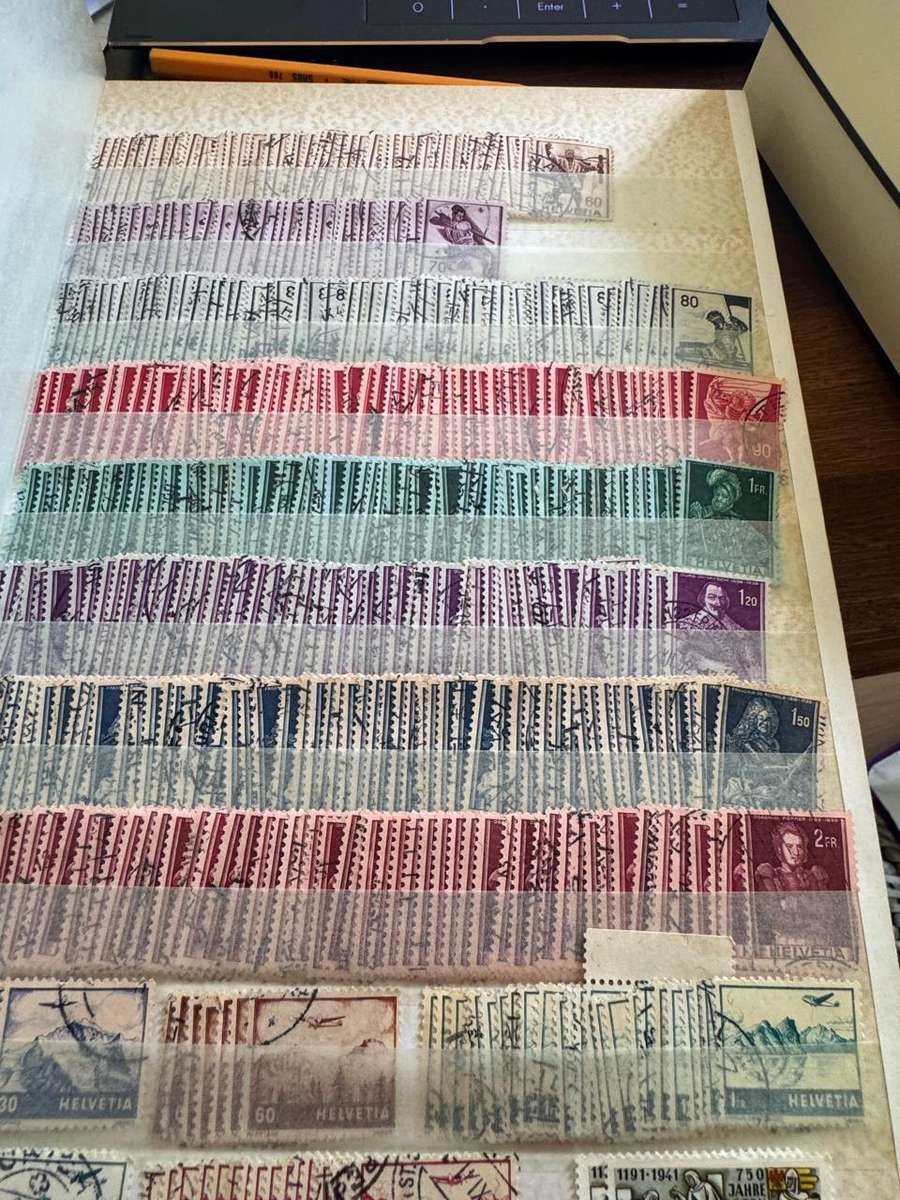 Malaysia,Switzerland ,Morocco, Kenya,Rwanda, Volta,Argentina Stamps in album