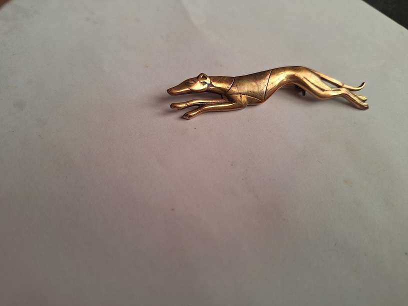Brass greyhound brooch