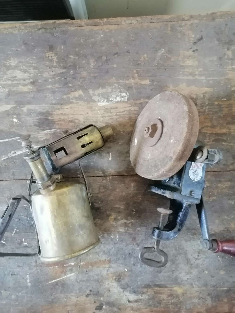 Antique blowtorch and hand grinder