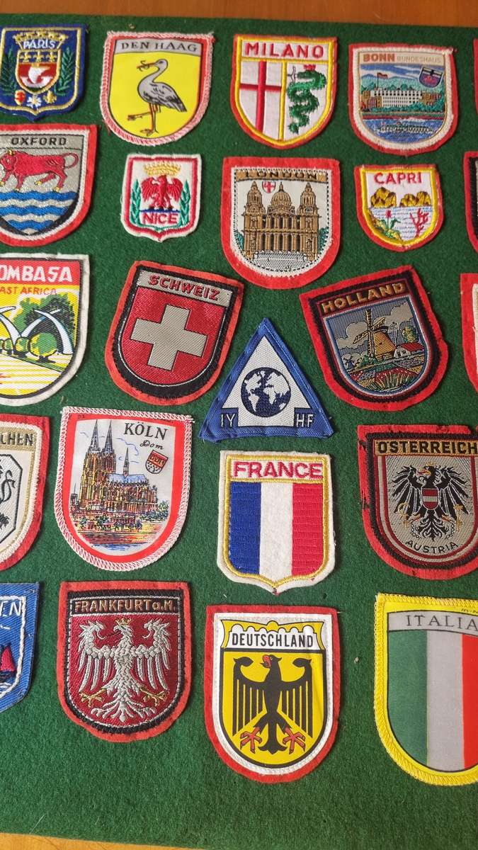 43 x Cloth Souvenir Badges in Excellent Condition neatly sewn patches, onto felt. Mombasa, Europe.