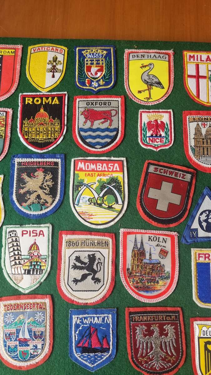 43 x Cloth Souvenir Badges in Excellent Condition neatly sewn patches, onto felt. Mombasa, Europe.