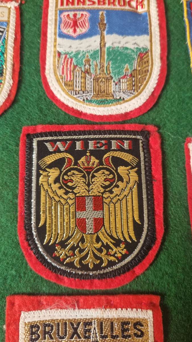 43 x Cloth Souvenir Badges in Excellent Condition neatly sewn patches, onto felt. Mombasa, Europe.