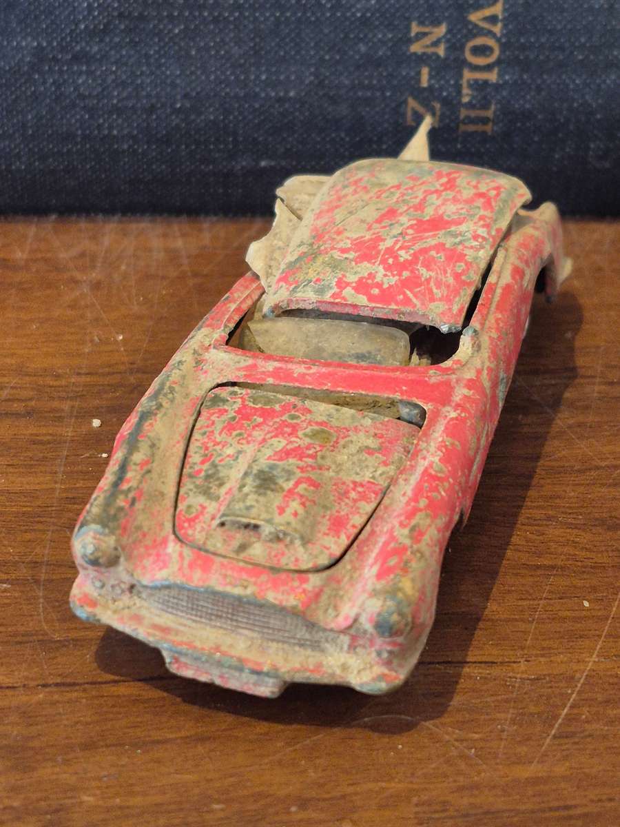 Corgi Toys Aston Martin D B 4 Red.  Die Cast Metal. Has had a nasty prang! 1960s Made Great Britain