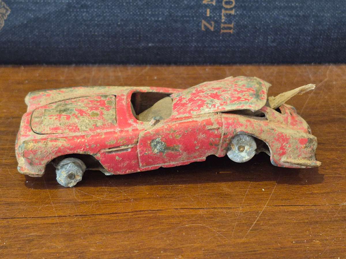 Corgi Toys Aston Martin D B 4 Red.  Die Cast Metal. Has had a nasty prang! 1960s Made Great Britain