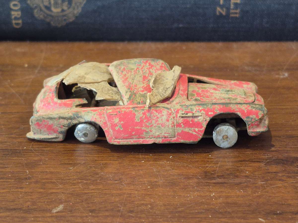 Corgi Toys Aston Martin D B 4 Red.  Die Cast Metal. Has had a nasty prang! 1960s Made Great Britain
