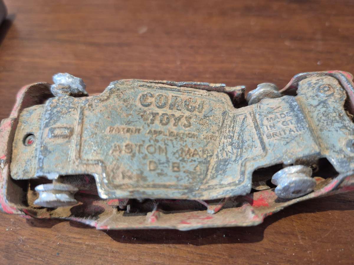 Corgi Toys Aston Martin D B 4 Red.  Die Cast Metal. Has had a nasty prang! 1960s Made Great Britain