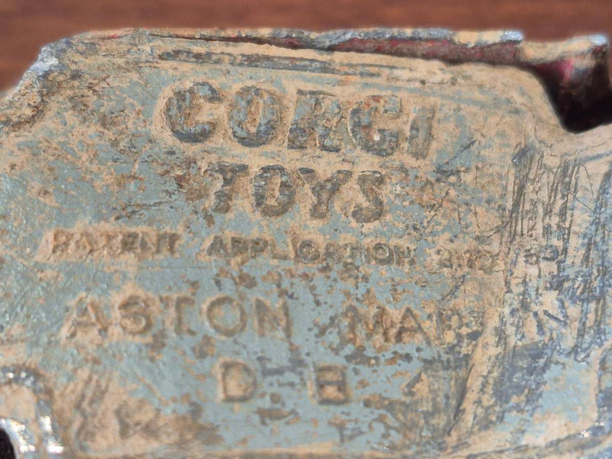 Corgi Toys Aston Martin D B 4 Red.  Die Cast Metal. Has had a nasty prang! 1960s Made Great Britain