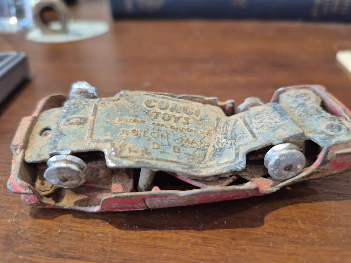 Corgi Toys Aston Martin D B 4 Red.  Die Cast Metal. Has had a nasty prang! 1960s Made Great Britain