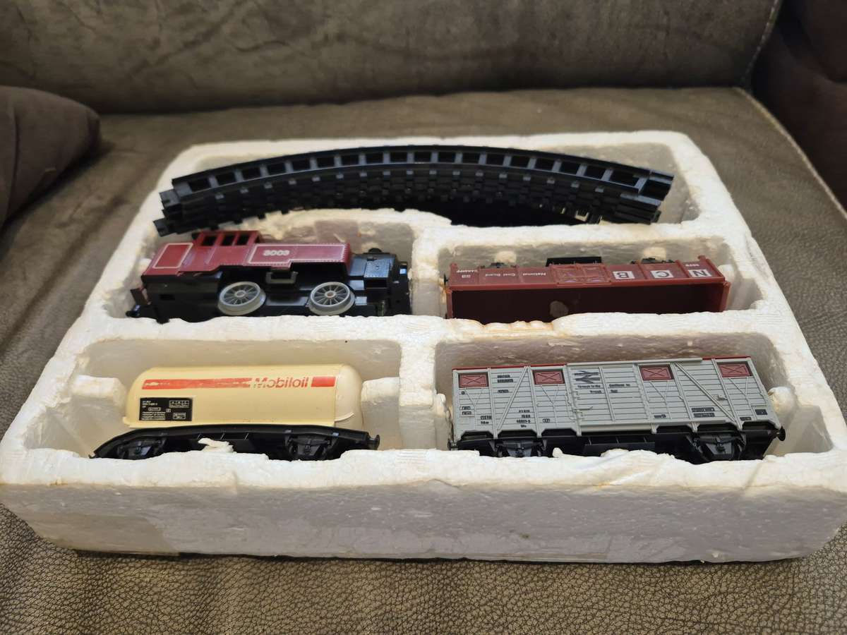 Toy Train Set. Locomotive with motor, 3 cars, and  14 tracks. Vintage British
