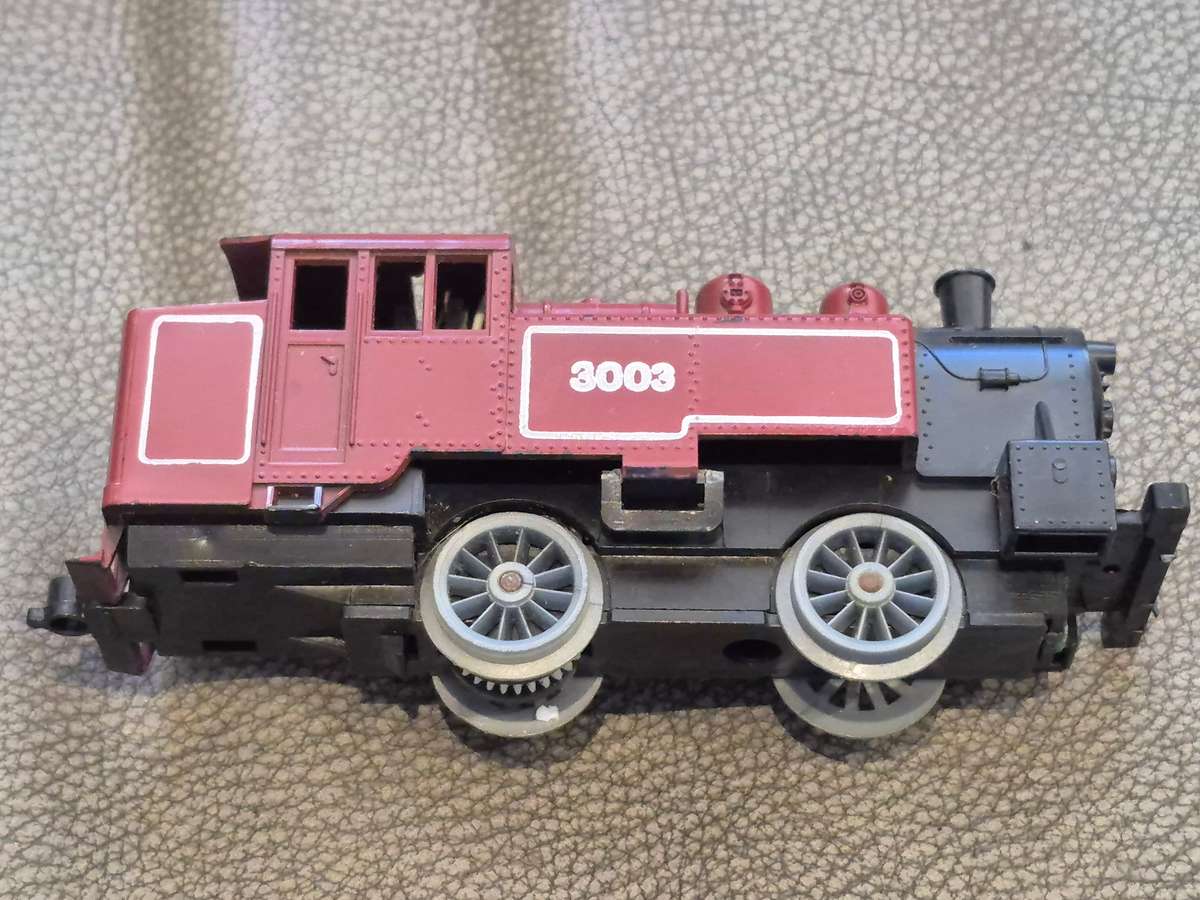 Toy Train Set. Locomotive with motor, 3 cars, and  14 tracks. Vintage British