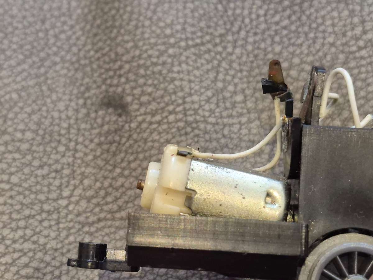 Toy Train Set. Locomotive with motor, 3 cars, and  14 tracks. Vintage British