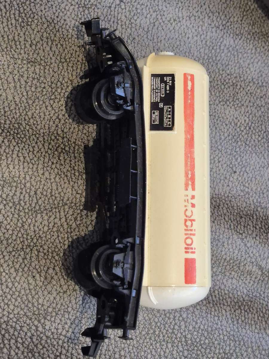 Toy Train Set. Locomotive with motor, 3 cars, and  14 tracks. Vintage British