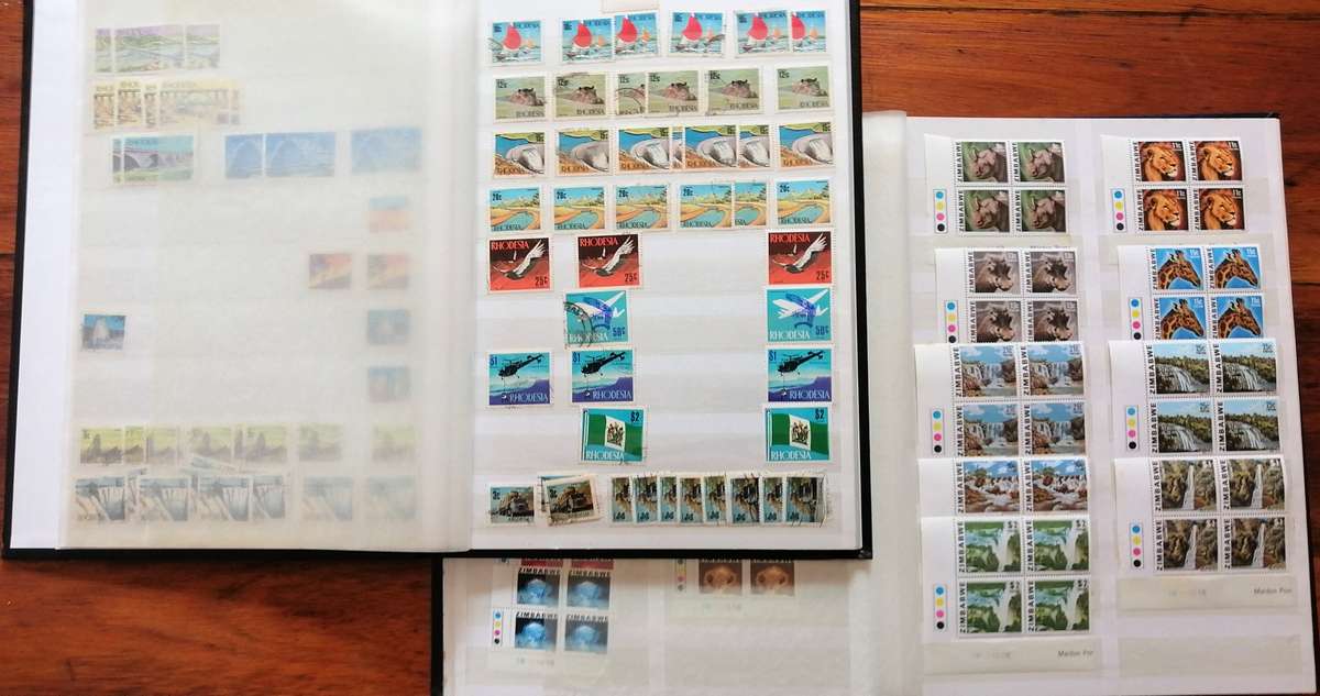 Later Rhodesia in 16 Pg album & Zimbabwe collection in 32 Pg - 2 second hand albums - not all shown