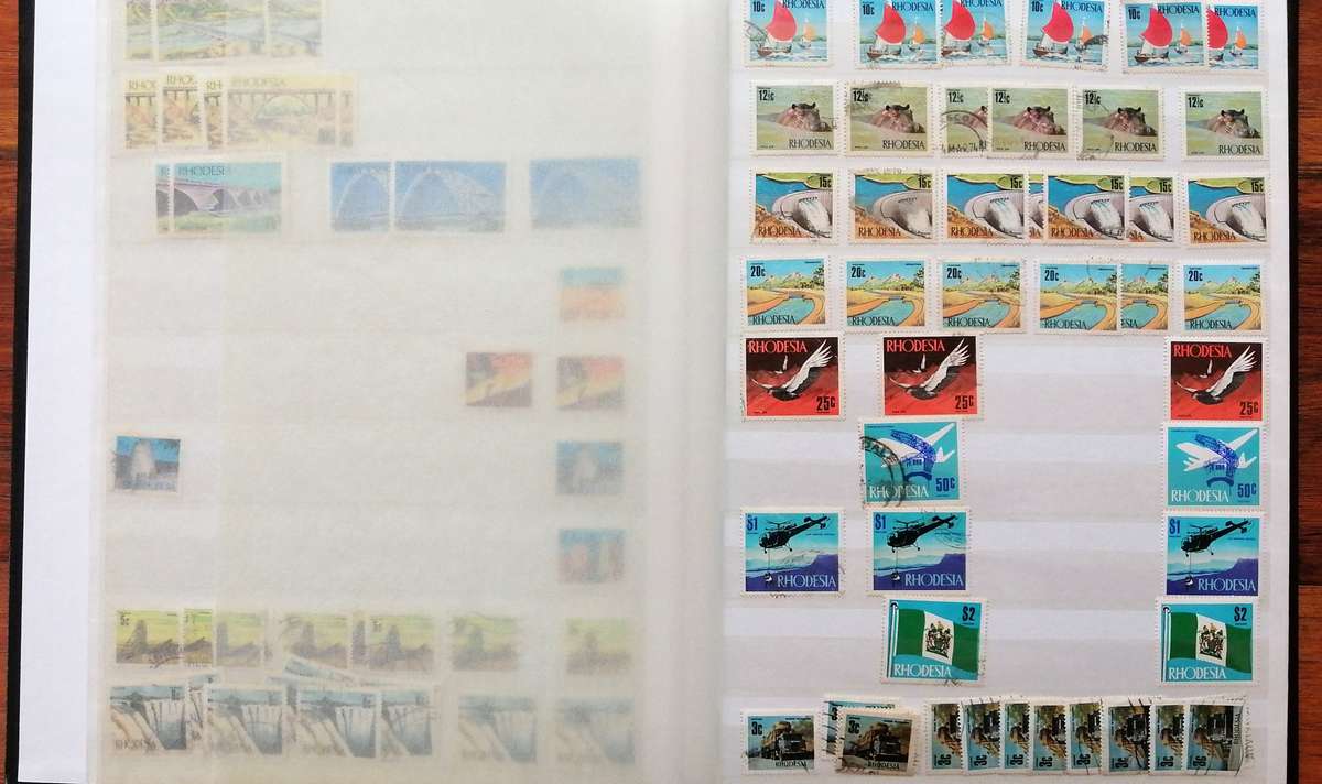 Later Rhodesia in 16 Pg album & Zimbabwe collection in 32 Pg - 2 second hand albums - not all shown