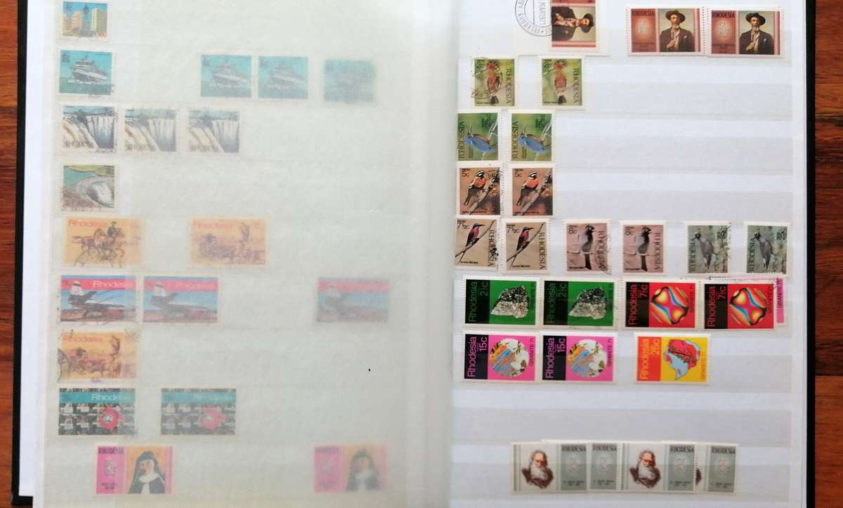 Later Rhodesia in 16 Pg album & Zimbabwe collection in 32 Pg - 2 second hand albums - not all shown