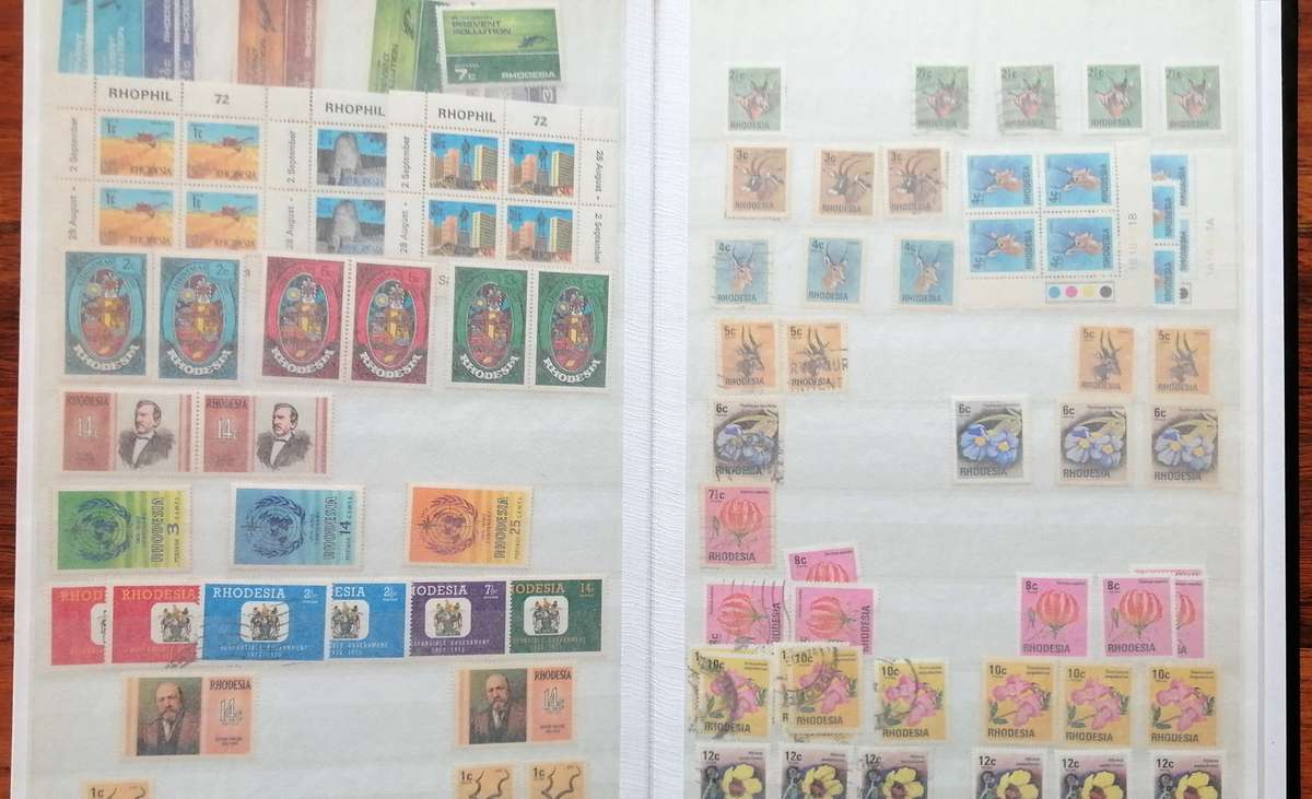 Later Rhodesia in 16 Pg album & Zimbabwe collection in 32 Pg - 2 second hand albums - not all shown