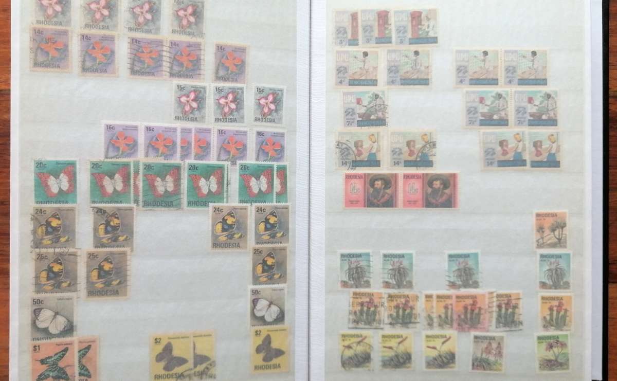 Later Rhodesia in 16 Pg album & Zimbabwe collection in 32 Pg - 2 second hand albums - not all shown