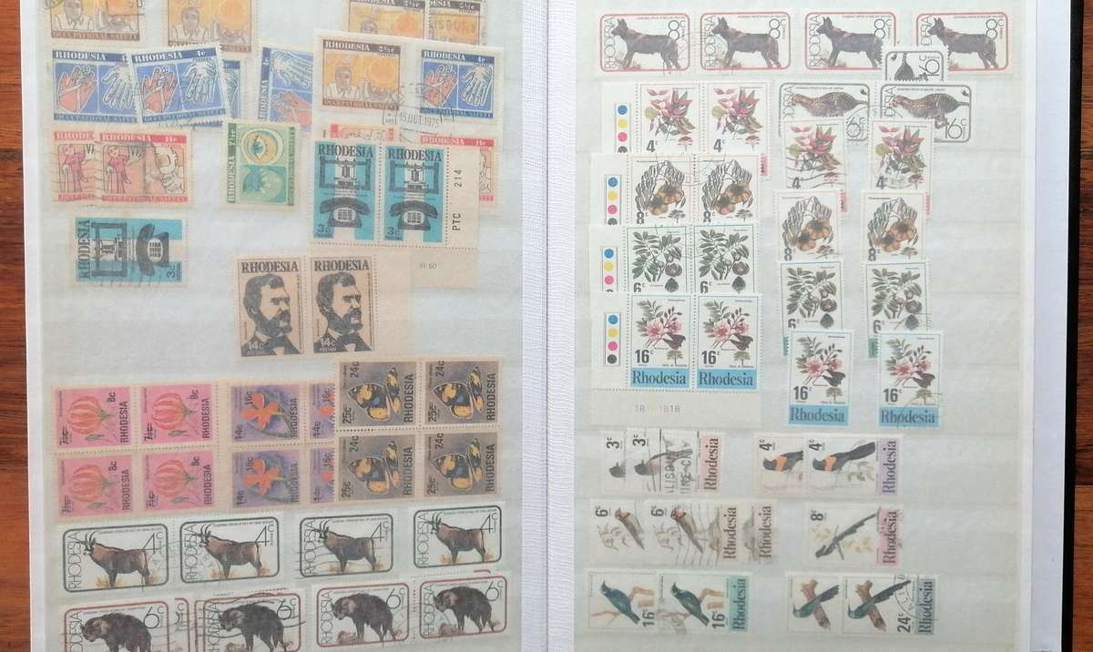 Later Rhodesia in 16 Pg album & Zimbabwe collection in 32 Pg - 2 second hand albums - not all shown