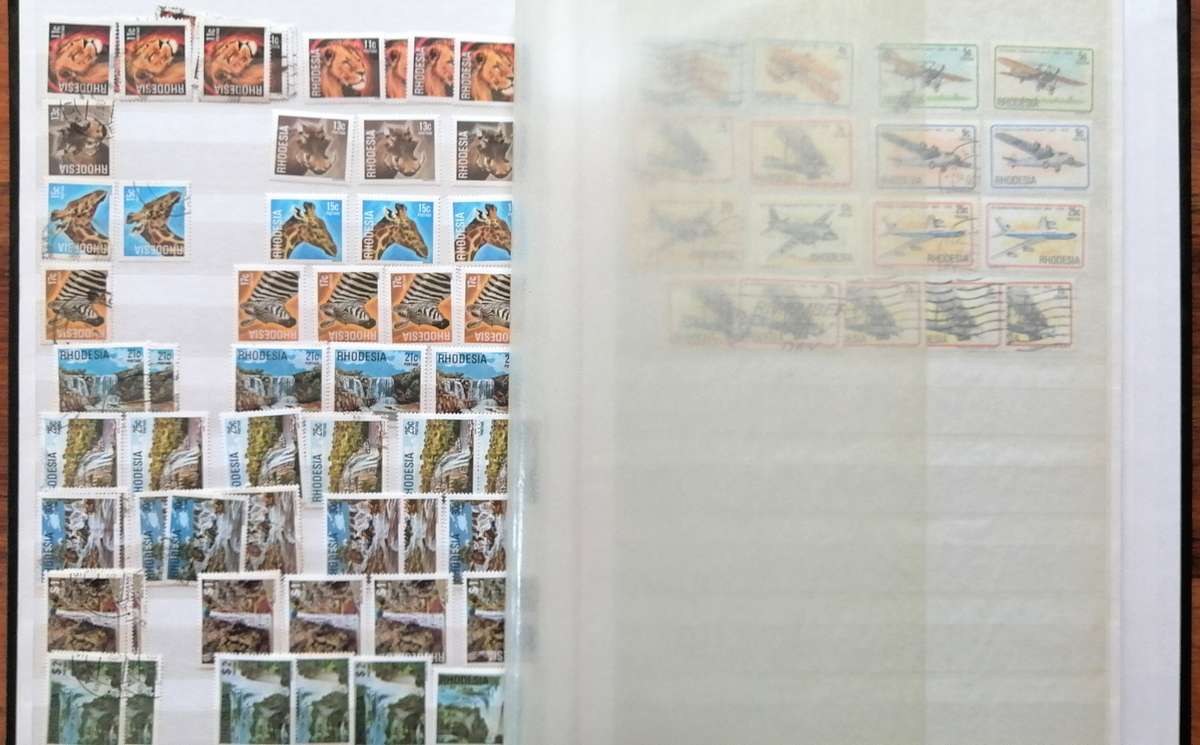 Later Rhodesia in 16 Pg album & Zimbabwe collection in 32 Pg - 2 second hand albums - not all shown