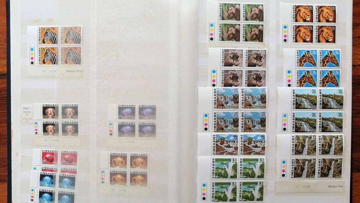 Later Rhodesia in 16 Pg album & Zimbabwe collection in 32 Pg - 2 second hand albums - not all shown
