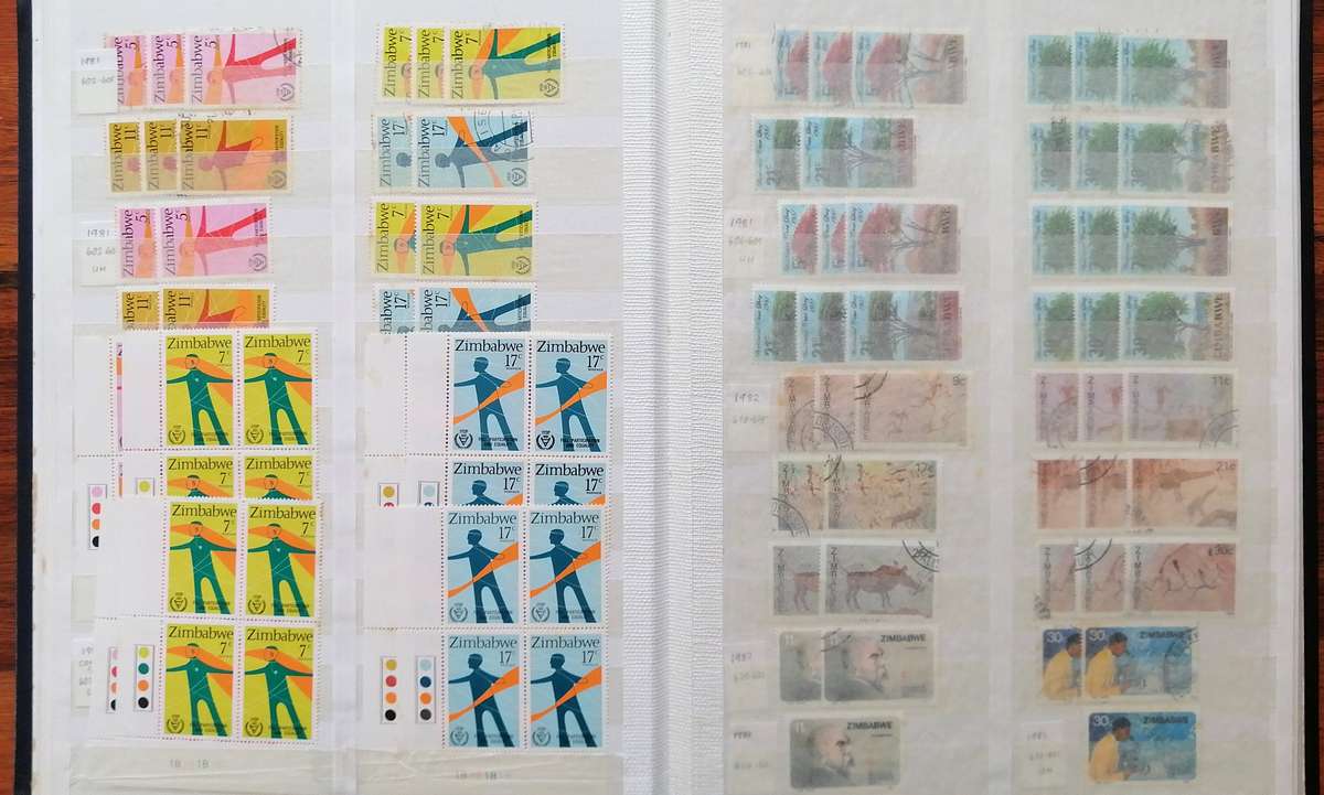 Later Rhodesia in 16 Pg album & Zimbabwe collection in 32 Pg - 2 second hand albums - not all shown