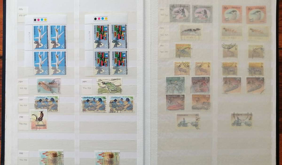 Later Rhodesia in 16 Pg album & Zimbabwe collection in 32 Pg - 2 second hand albums - not all shown