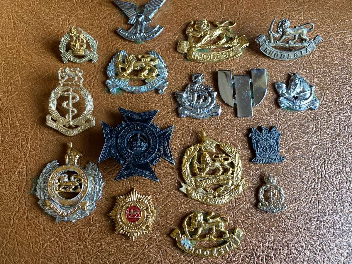 MIXED LOT OF RHODESIAN BADGES-MOST WITHOUT LUGS- 16 IN TOTAL
