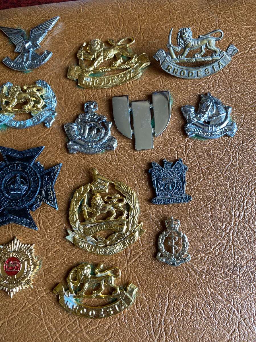 MIXED LOT OF RHODESIAN BADGES-MOST WITHOUT LUGS- 16 IN TOTAL