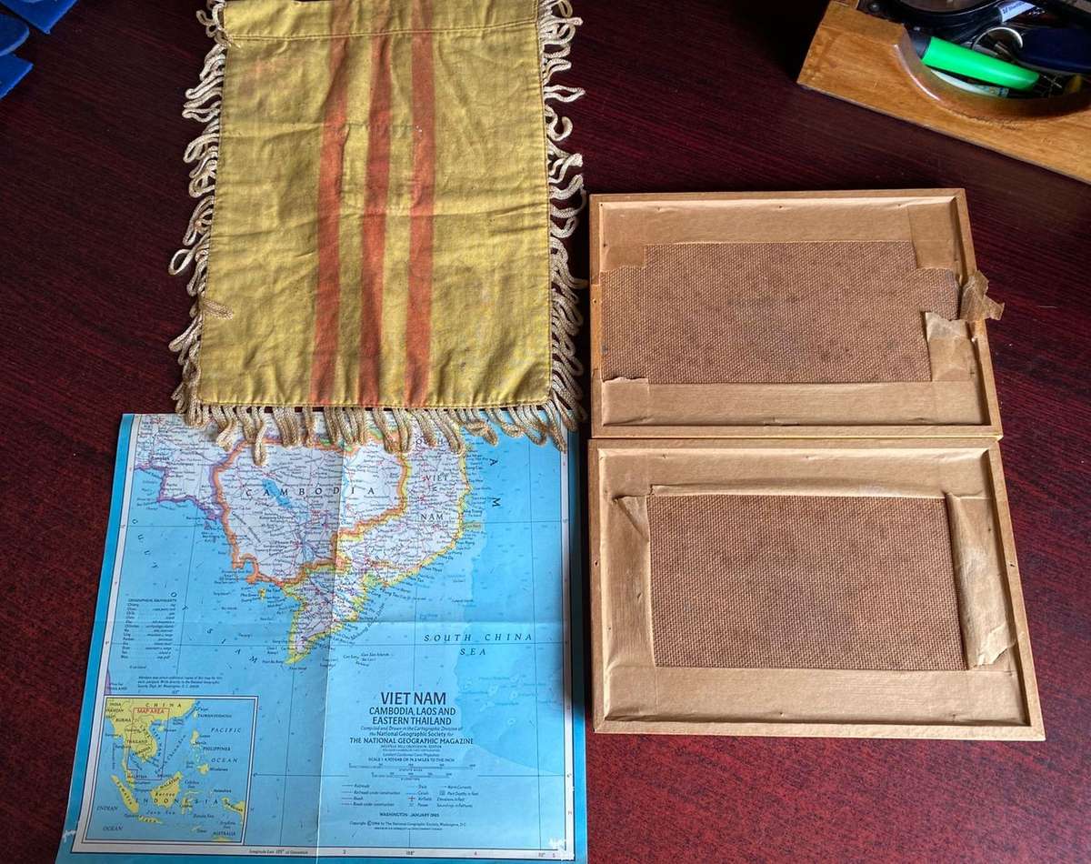 A BANNER WITH A WOVEN PATCH FOR THE VIETENAM WAR ARVN(ARMY OF THE REP. OF VIETNAM)AIR FORCE SURVEILL