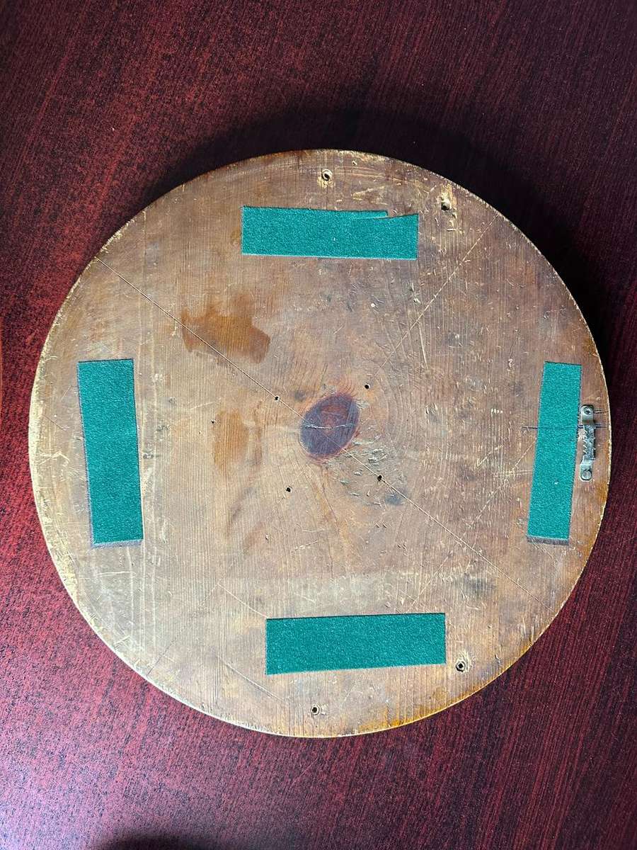 ANTIQUE IRON EMBOSSED SIDE PROFILE OF PRESIDNT PAUL KRUGER ON WOODEN BASE-HEAVY-DIAMETER 35,5 CM