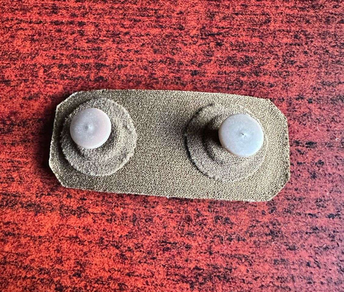 SADF PERIOD EMBOSSED (TUPPER) MARKSMAN BADGE- 2 PINS