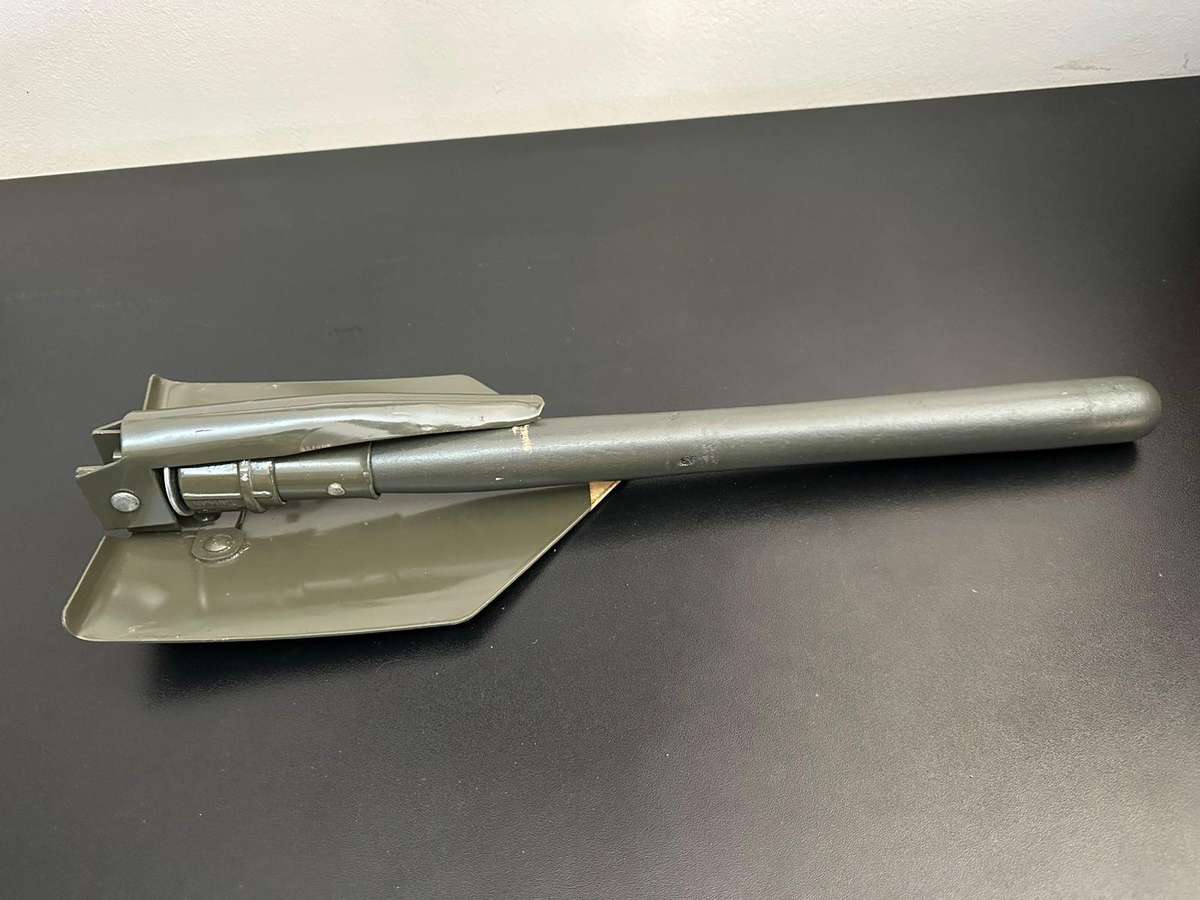 Portable, foldable spade with pick on the one side,length folded 47cm. Condition unused