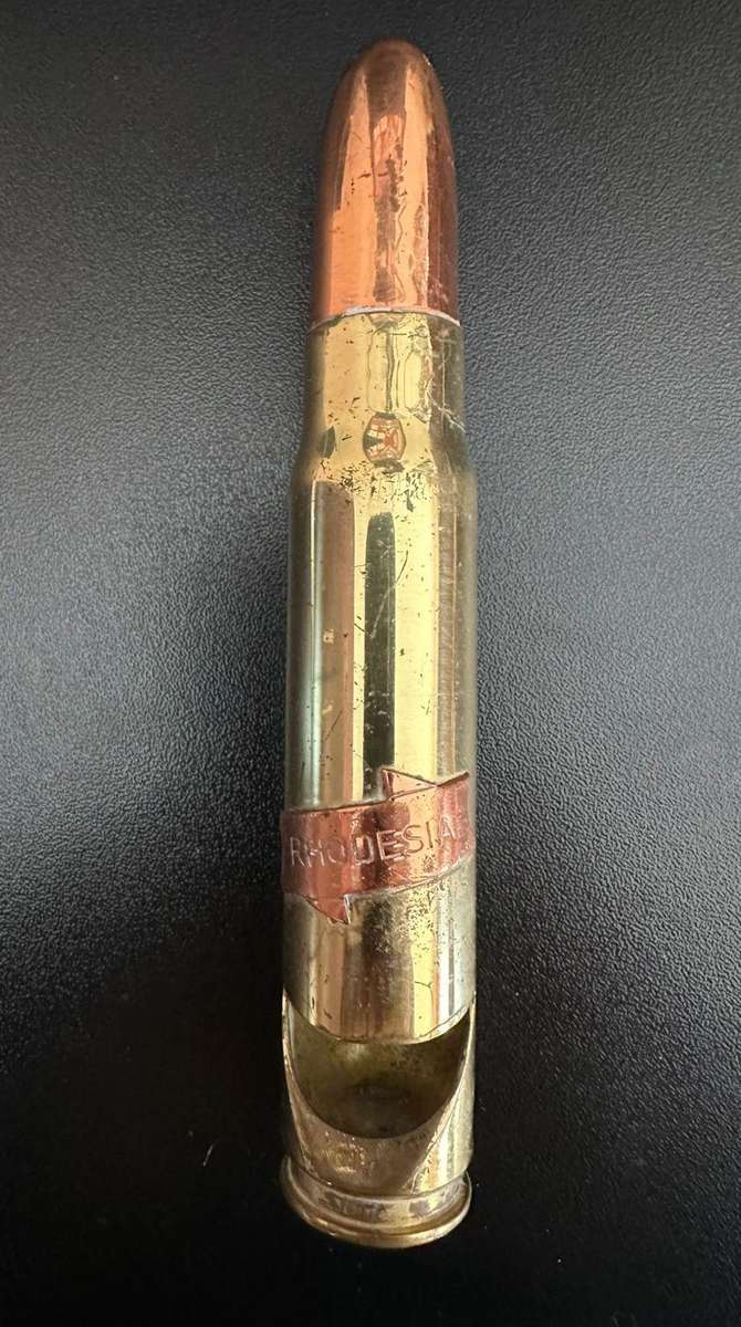 Rhodesia 20 mm spend round made into a bottle opener.