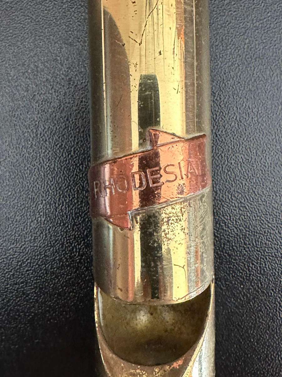 Rhodesia 20 mm spend round made into a bottle opener.